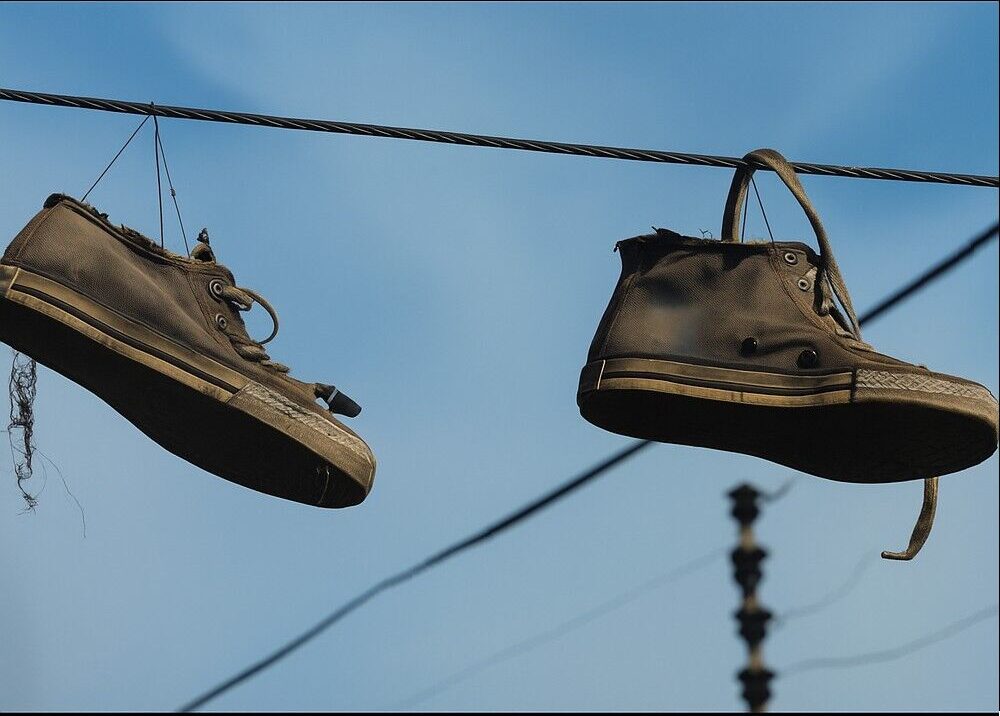 Why Shoes Hanging on Power Lines Capture Our Curiosity — and What They Really Mean